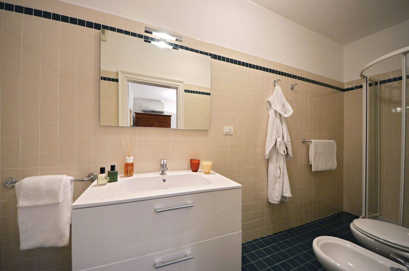 the en-suite bathroom of the second bedroom has a shower cabin