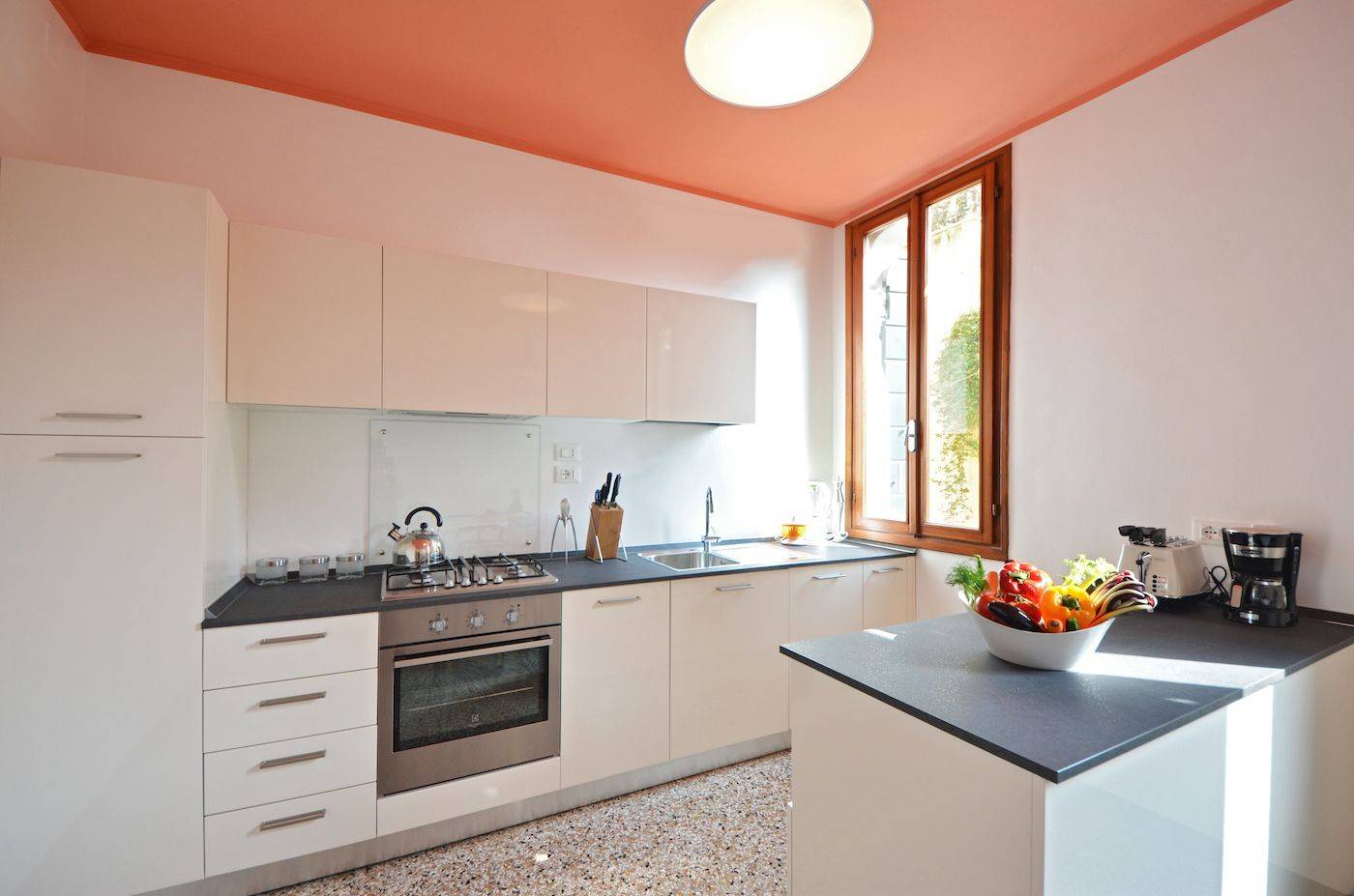 spacious dining room with very functional kitchen and view on gardens