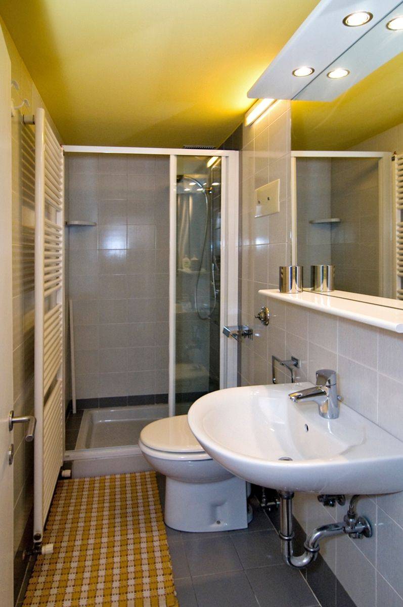 smaller bathroom with shower cabin