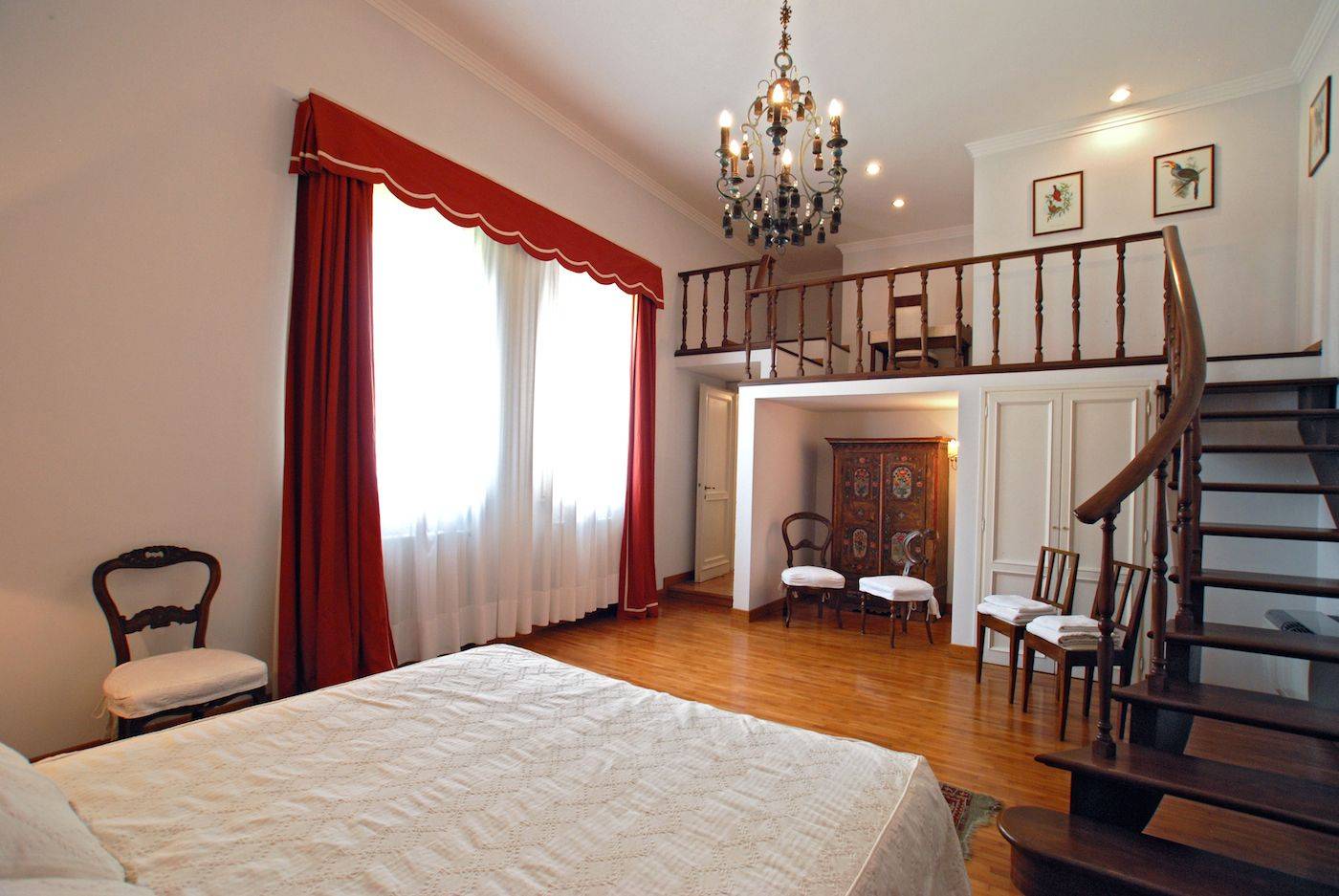 the huge master bedroom with gallery and view on the garden the huge master bedroom with gallery and view on the garden