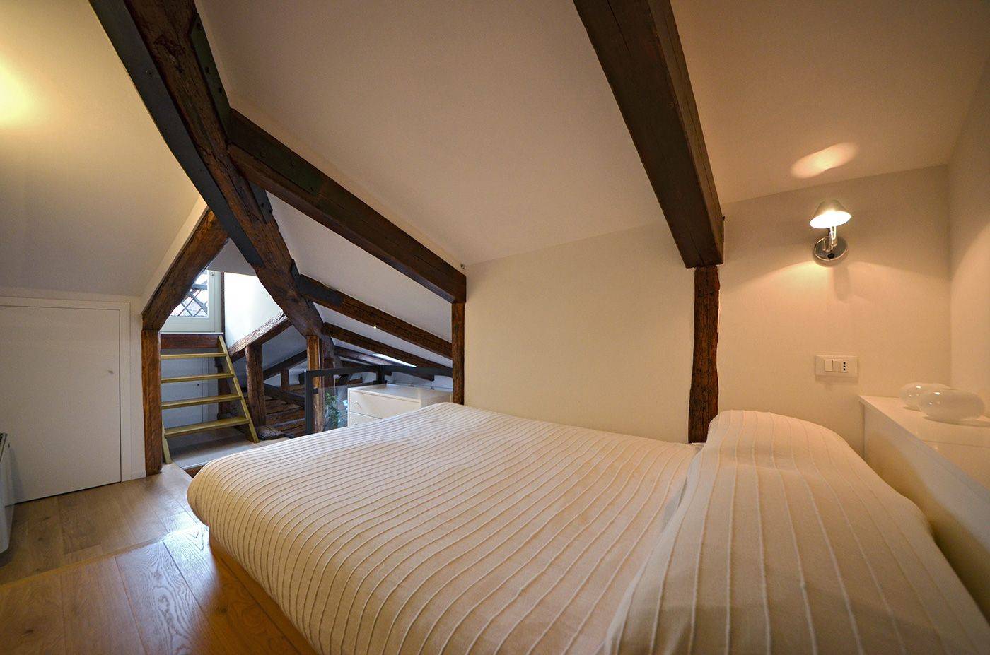 in the attic level there is a 140 cm wide bed