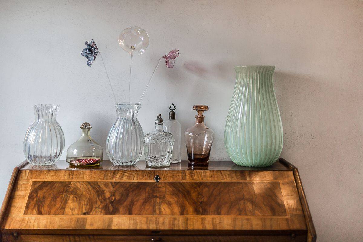 the apartment is finely furnished with Murano glass objects
