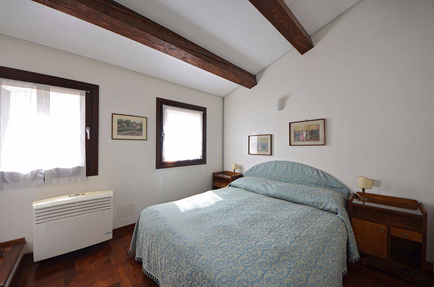 comfortable master bedroom with large wardrobe