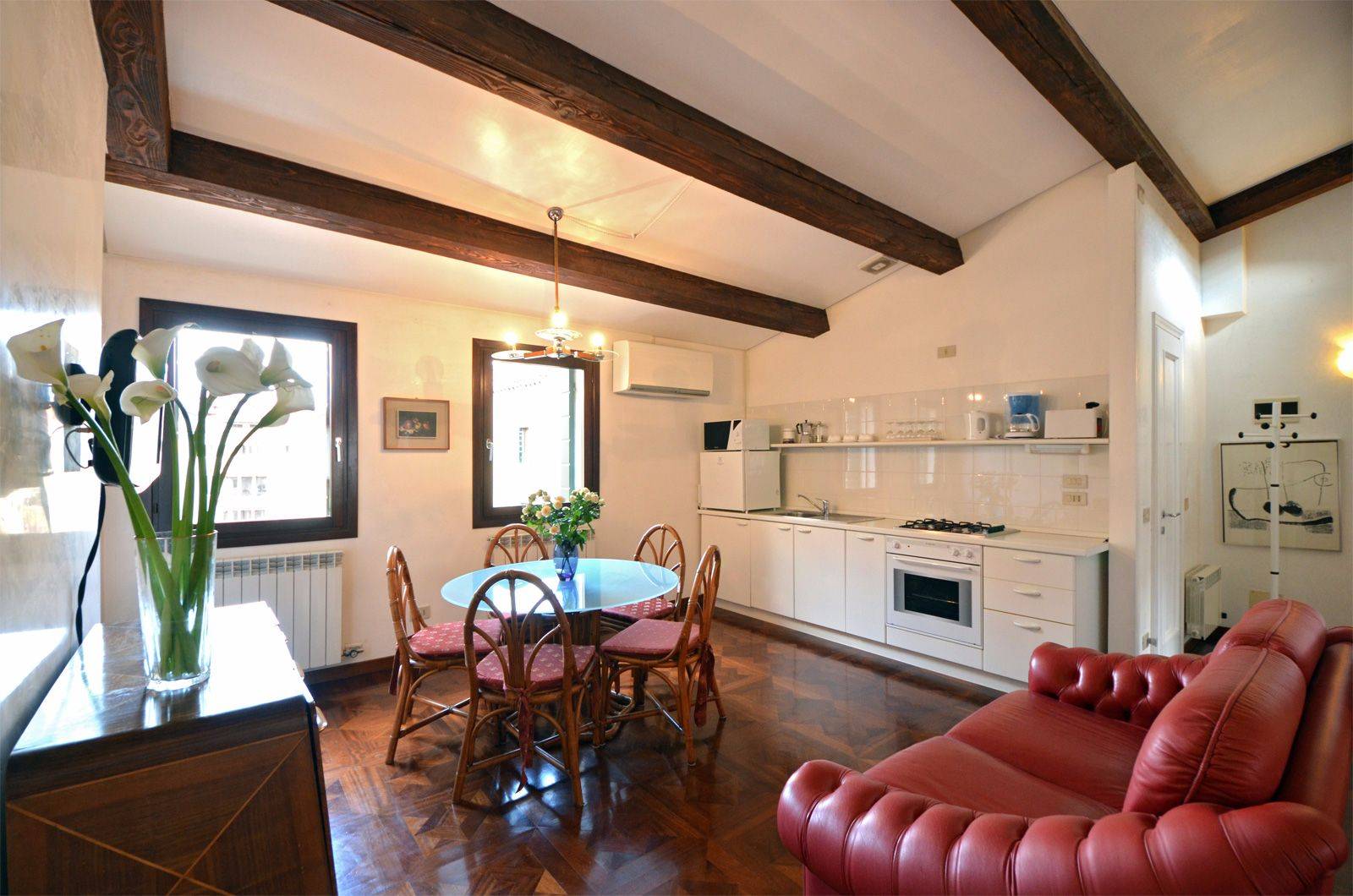 nice parquet flooring, wooden beams, interesting antiques...