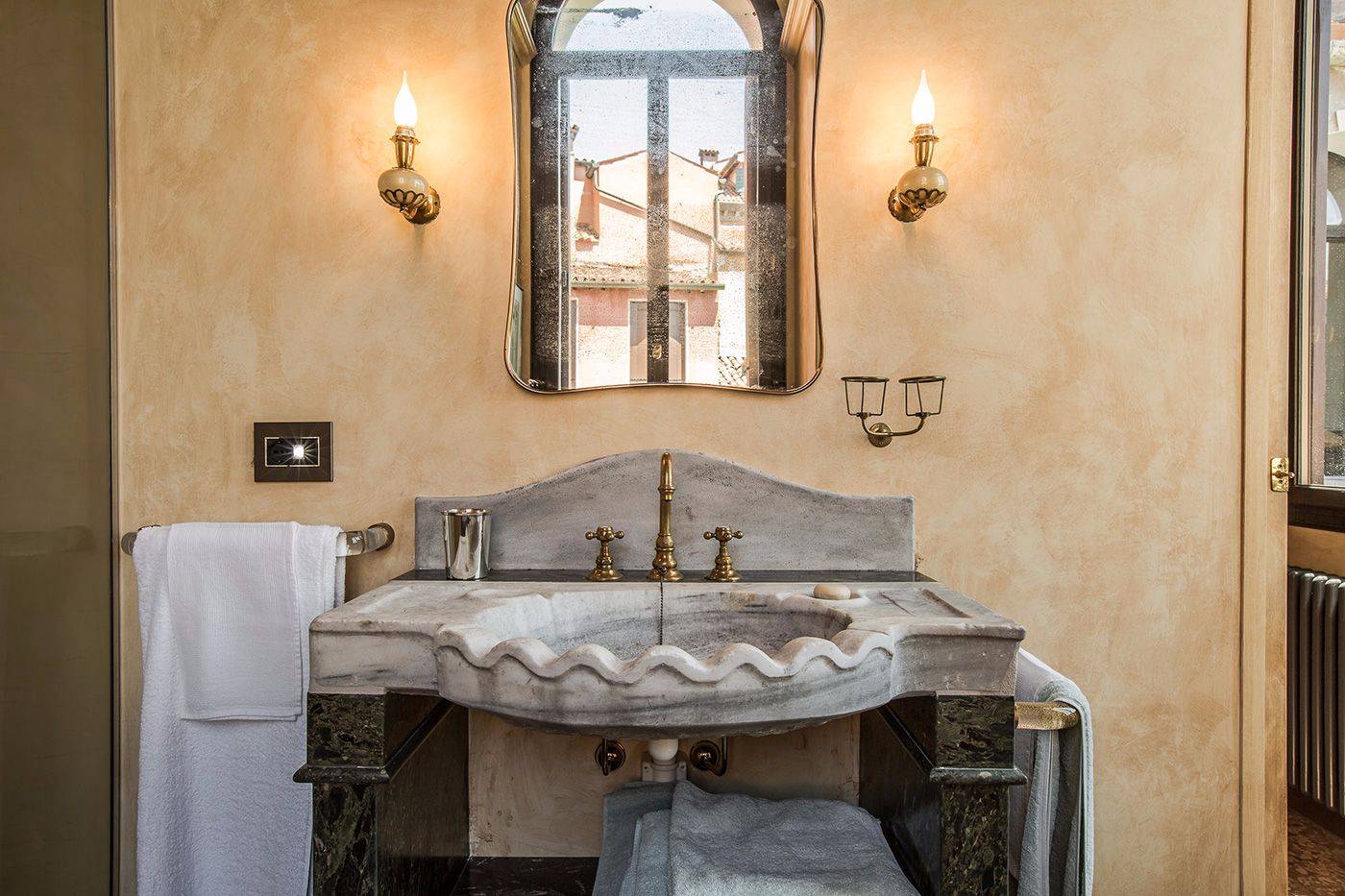 with antique stone wash-basin and large shower cabin