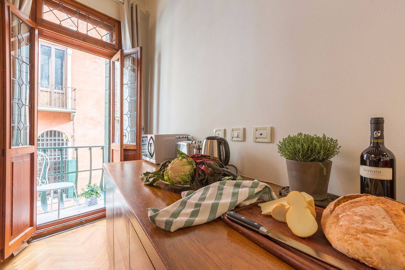 from the kitchen you can access the second balcony on the canal