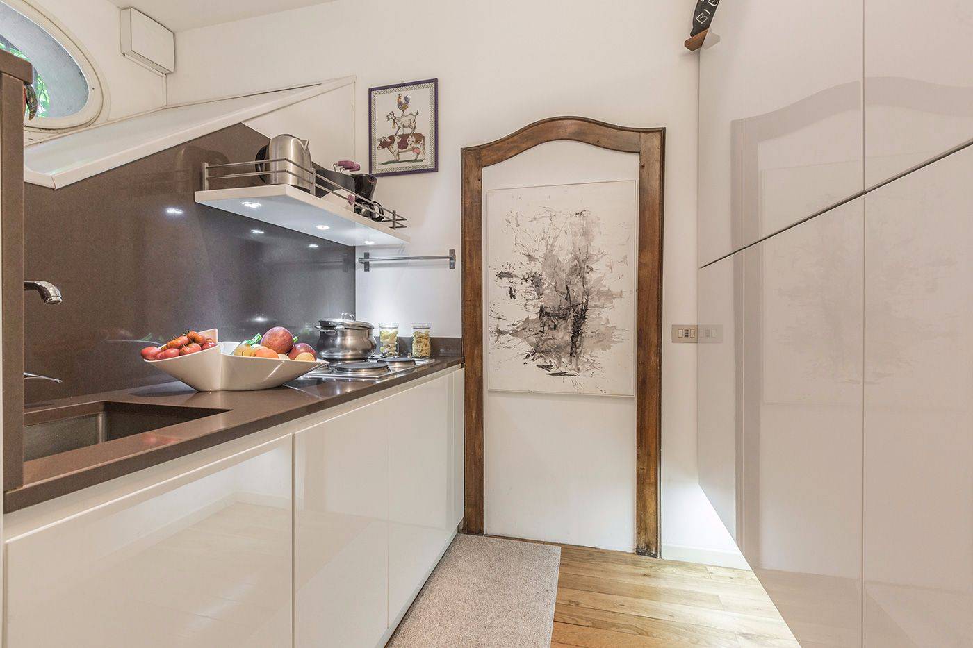 the kitchen has plenty of spacious cupboards on the right and the appliances on the left