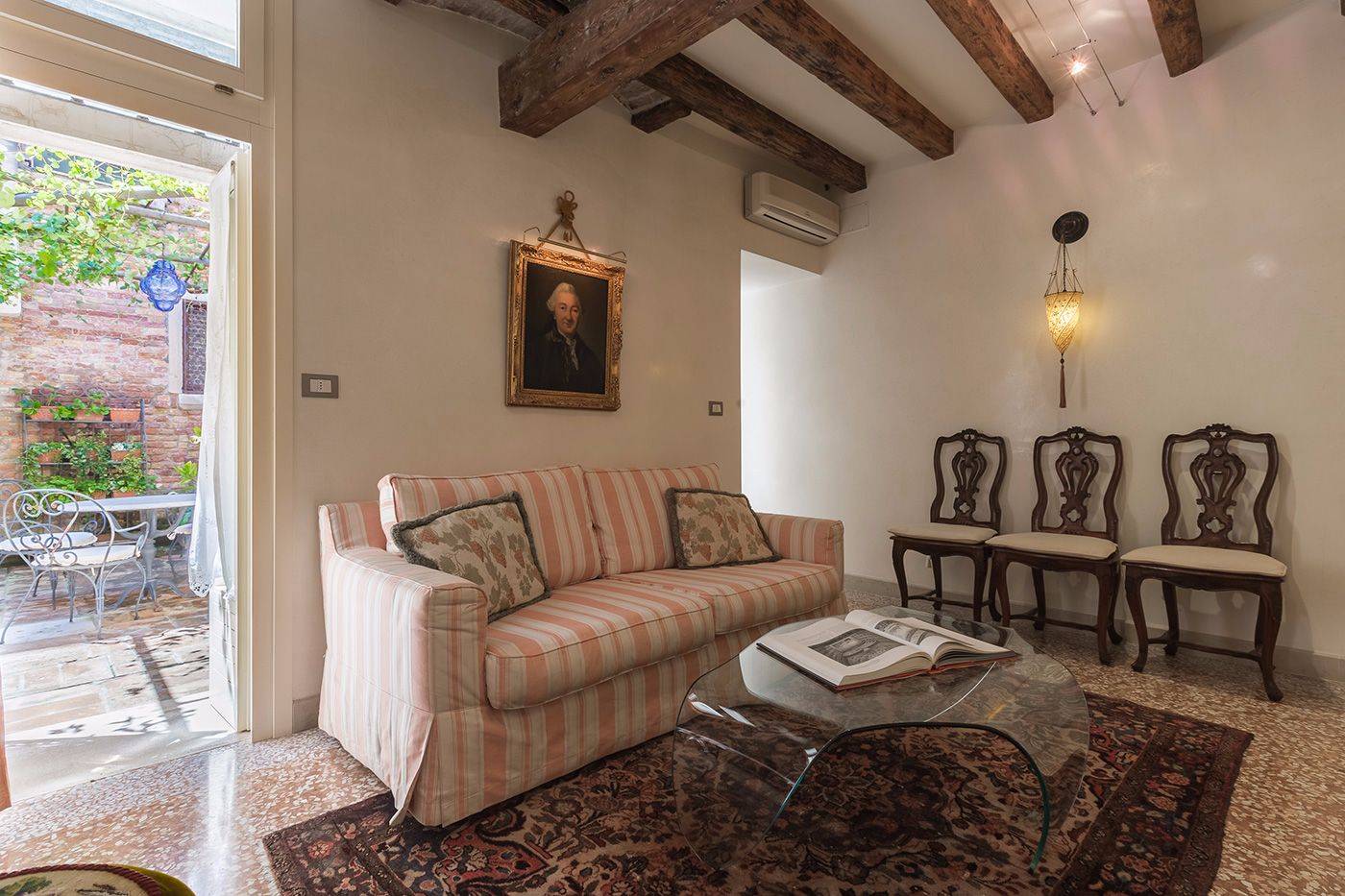 the living room is also connected to the external courtyard