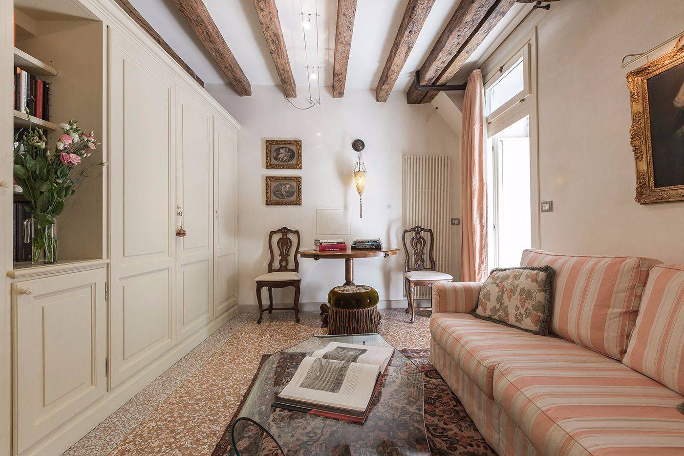 the wardrobe contains the entertainment system that can be hidden when not in use