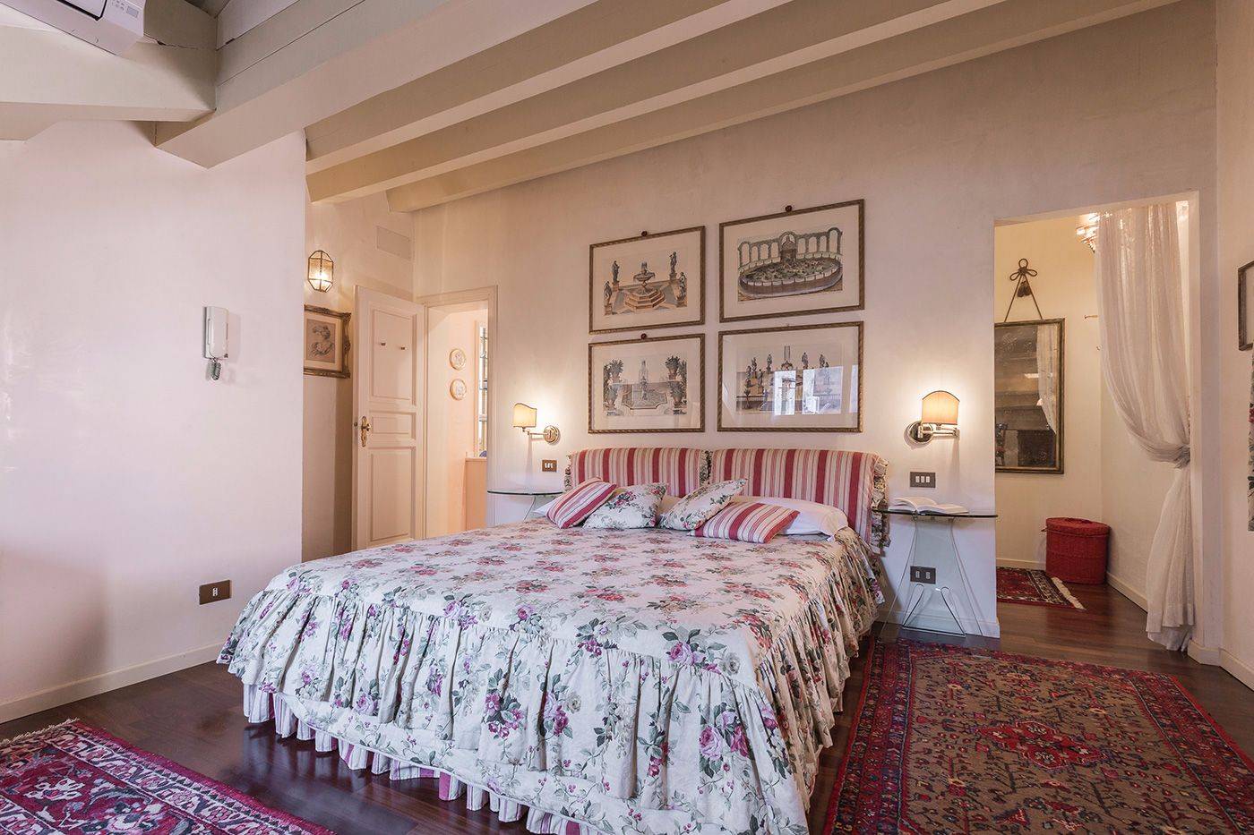 on the right side of the bed you can access the walk-in wardrobe