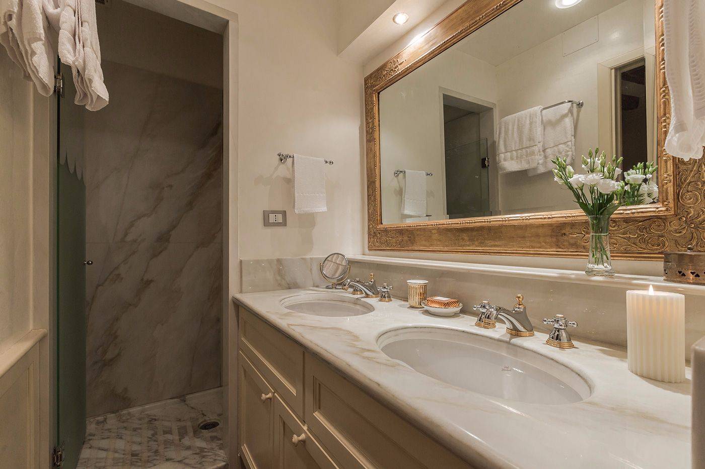en-suite bathroom of the seconf bedroom with marble top and beautiful shower cabin