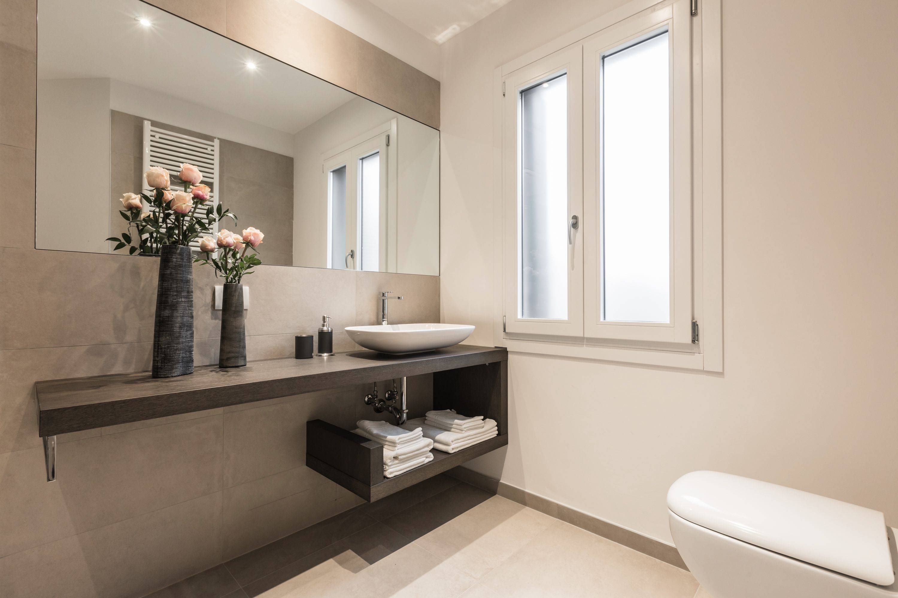 the main bathroom is large, stylish and bright...