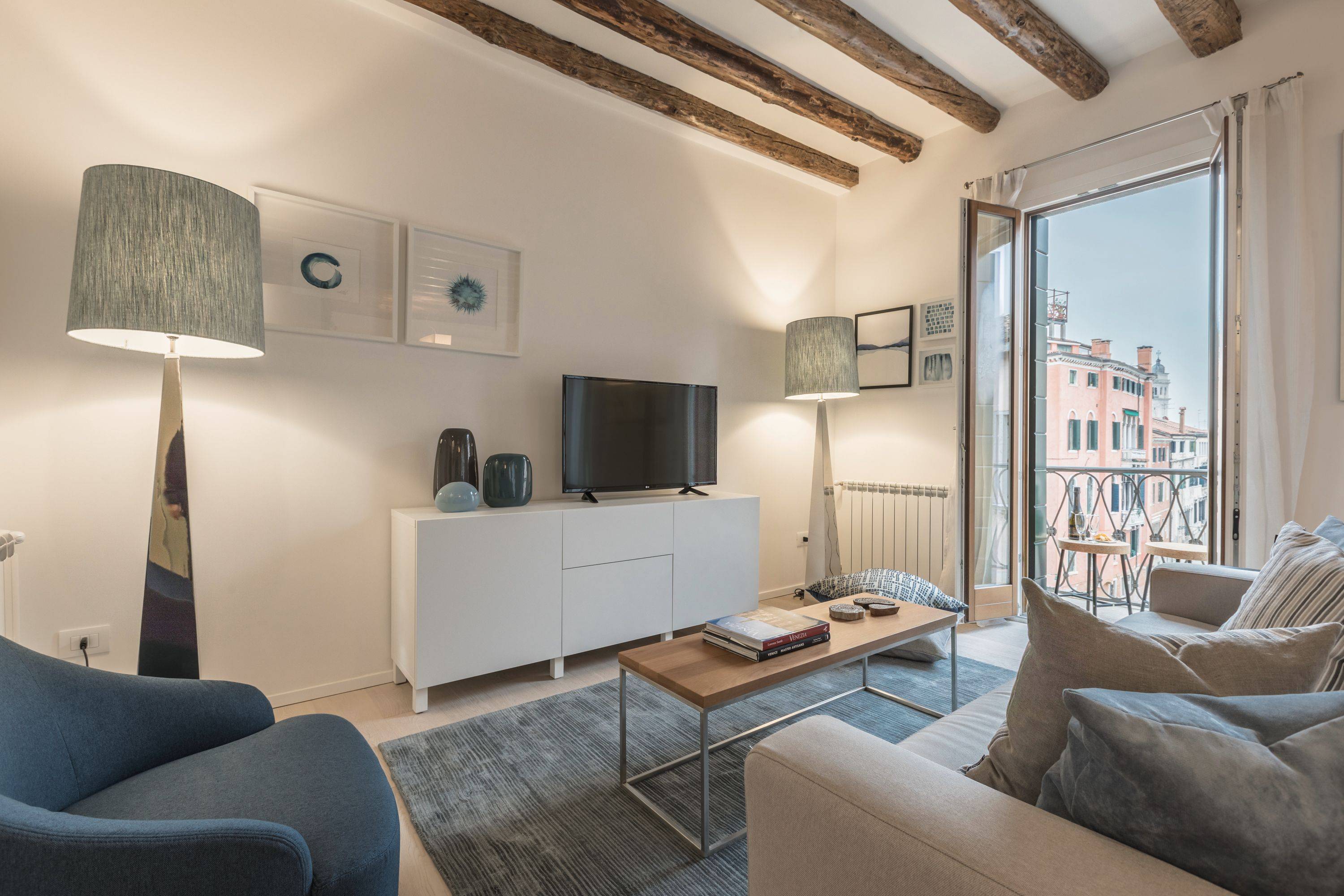 bright and airy living room with panoramic canal view