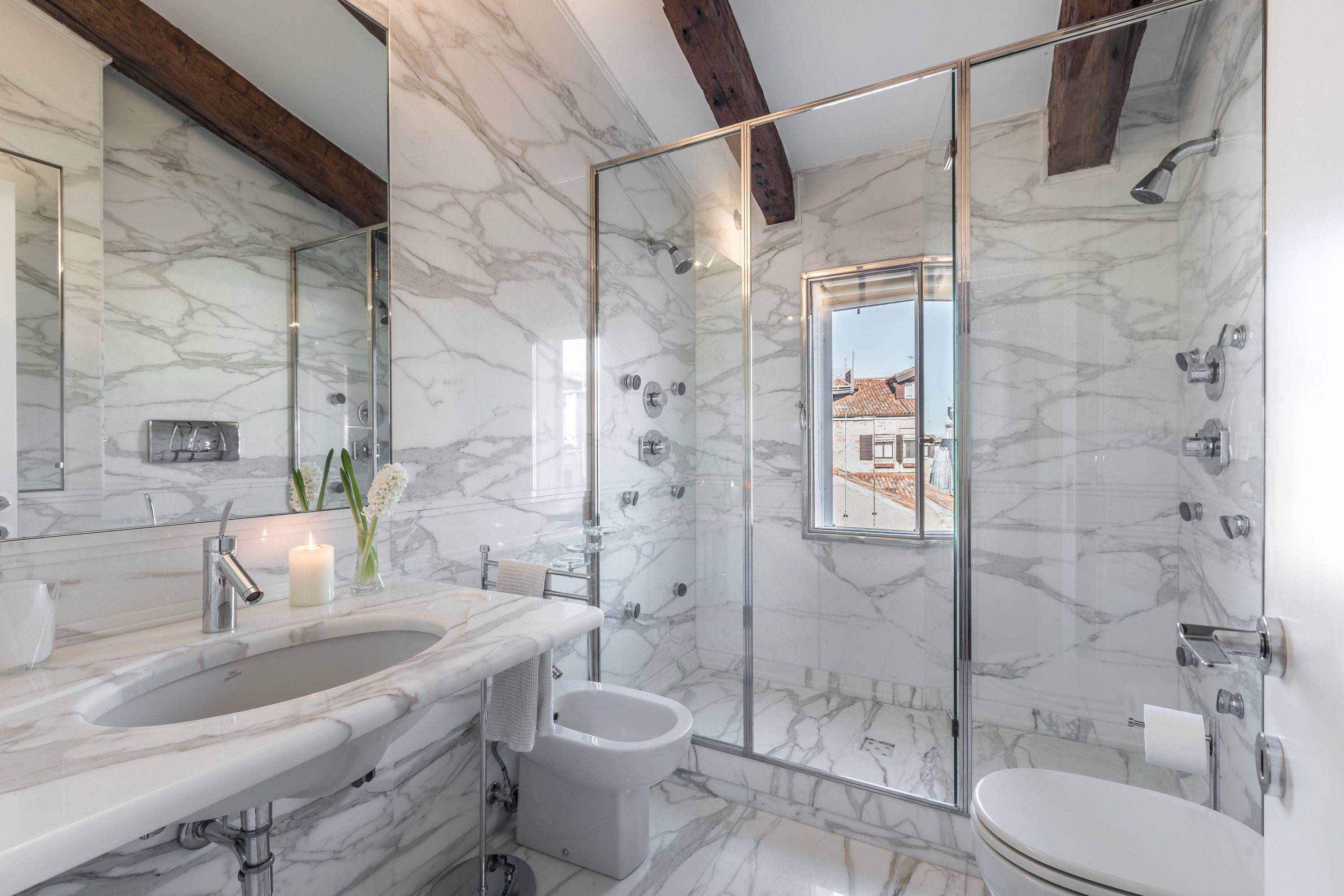precious marble bathroom with large shower cabin