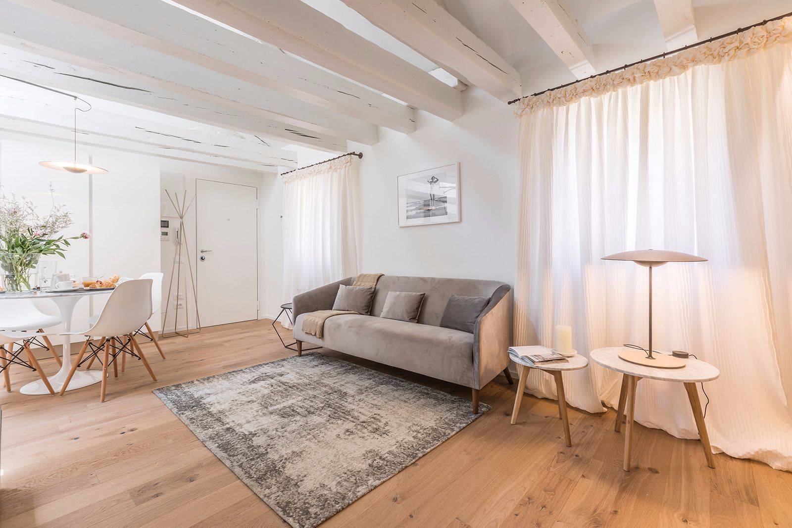 nice parquet flooring, wooden beams, designer furniture 