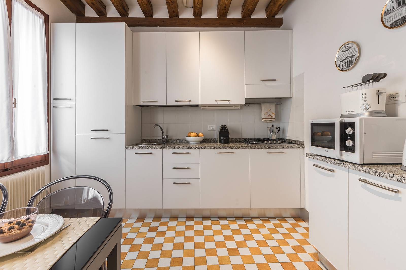 the kitchen is very bright and fully equipped and spacious the kitchen is very bright and fully equipped and spacious