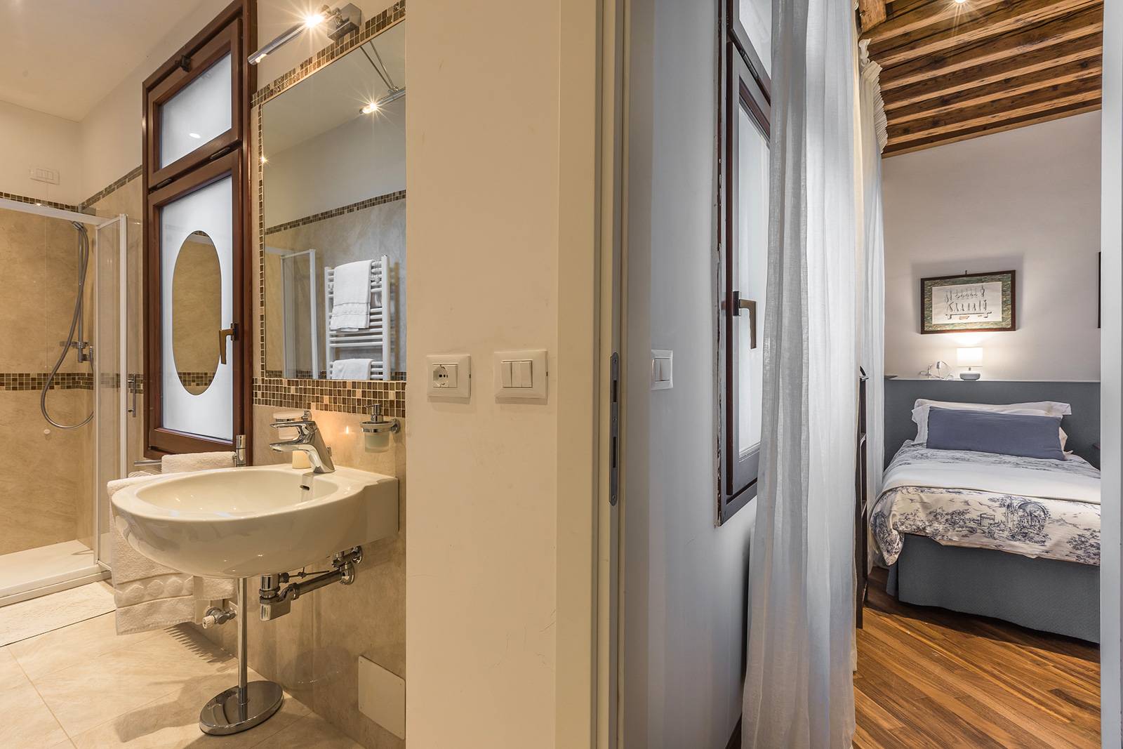 there is a washing machine and a large shower cabin there is a washing machine and a large shower cabin