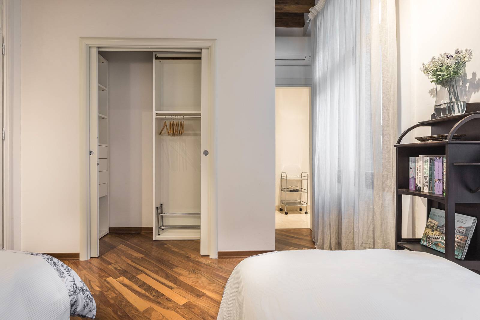 there is a walk-in wardrobe with sliding doors there is a walk-in wardrobe with sliding doors