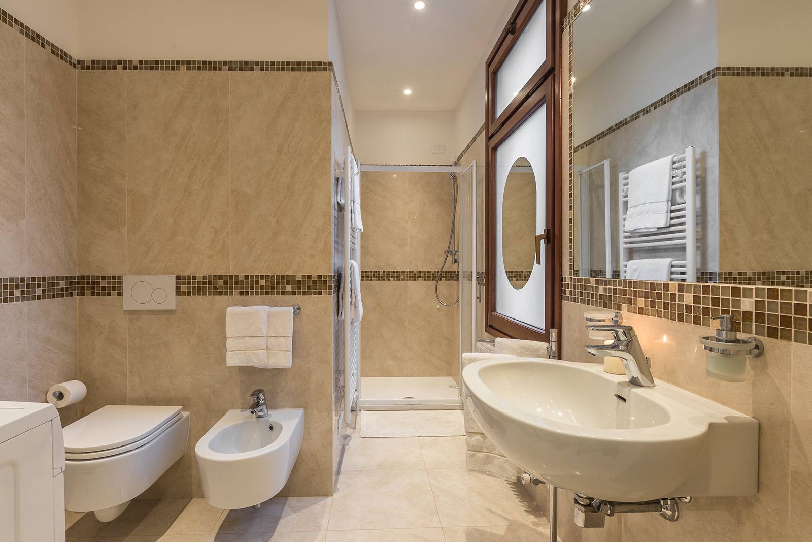 large en-suite bathroom made with marble and mosaic tiles large en-suite bathroom made with marble and mosaic tiles