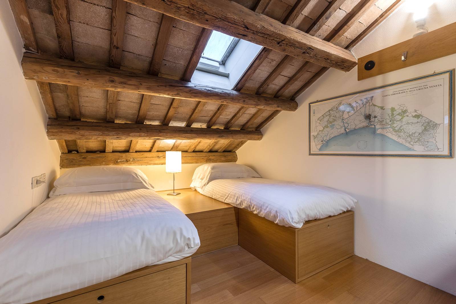 in the attic room there is a large futon that can be used as 2 single beds...
