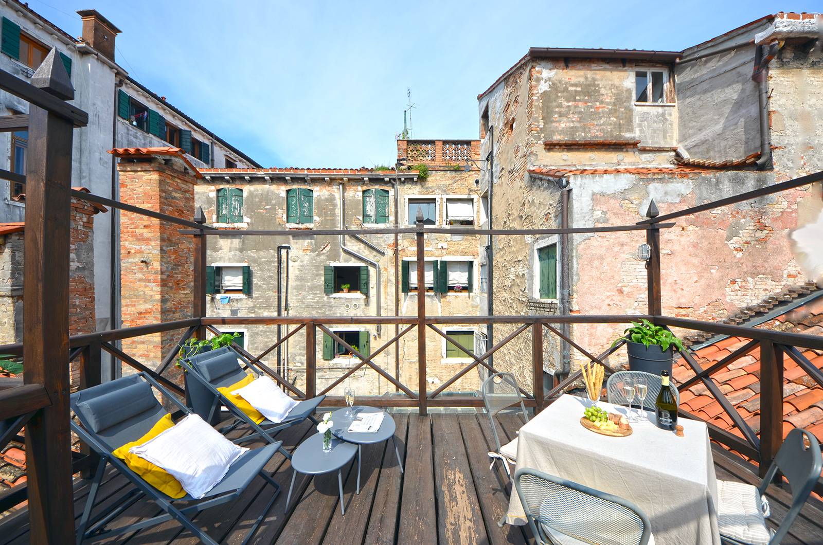 the terrace is very spacious and furnished with sun chairs and table the terrace is very spacious and furnished with sun chairs and table