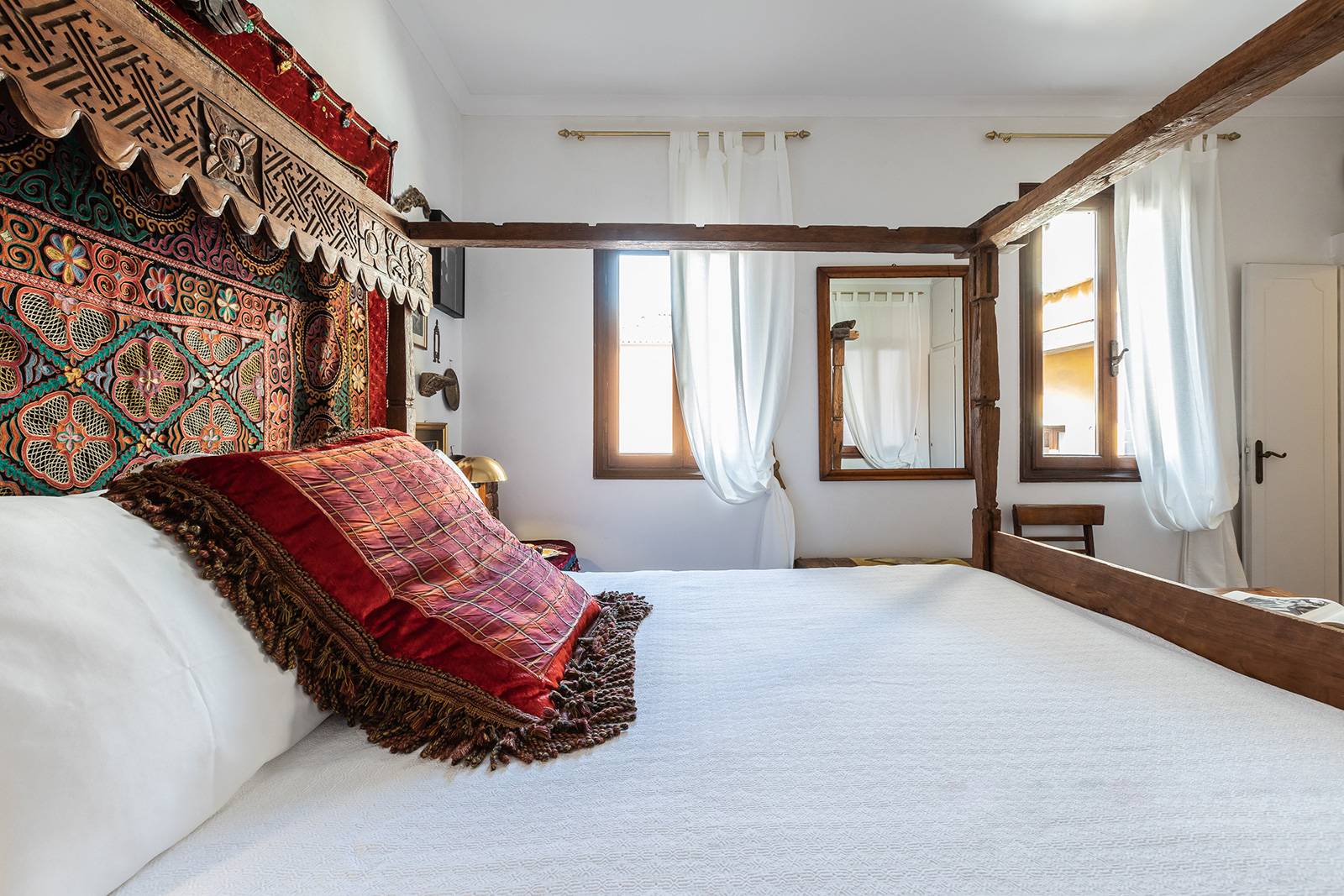 double bedroom at the 1st floor with antique wooden baldachin