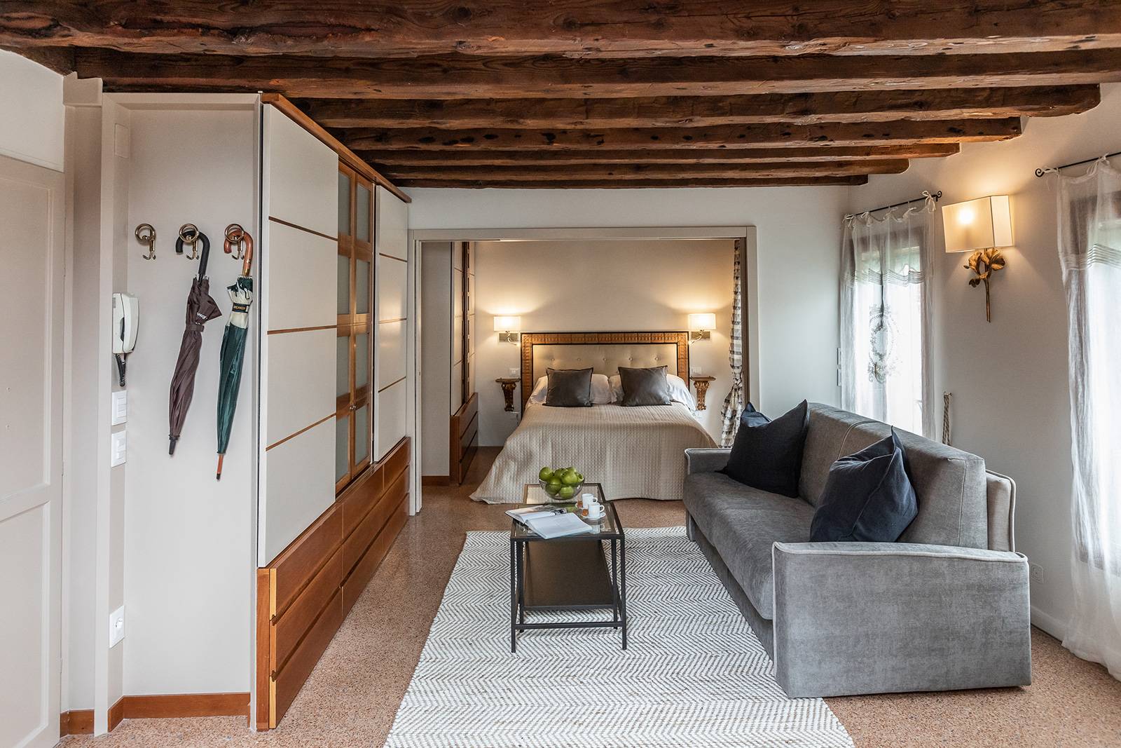 the antique wooden beams and the Terrazzo Veneziano flooring are authentic