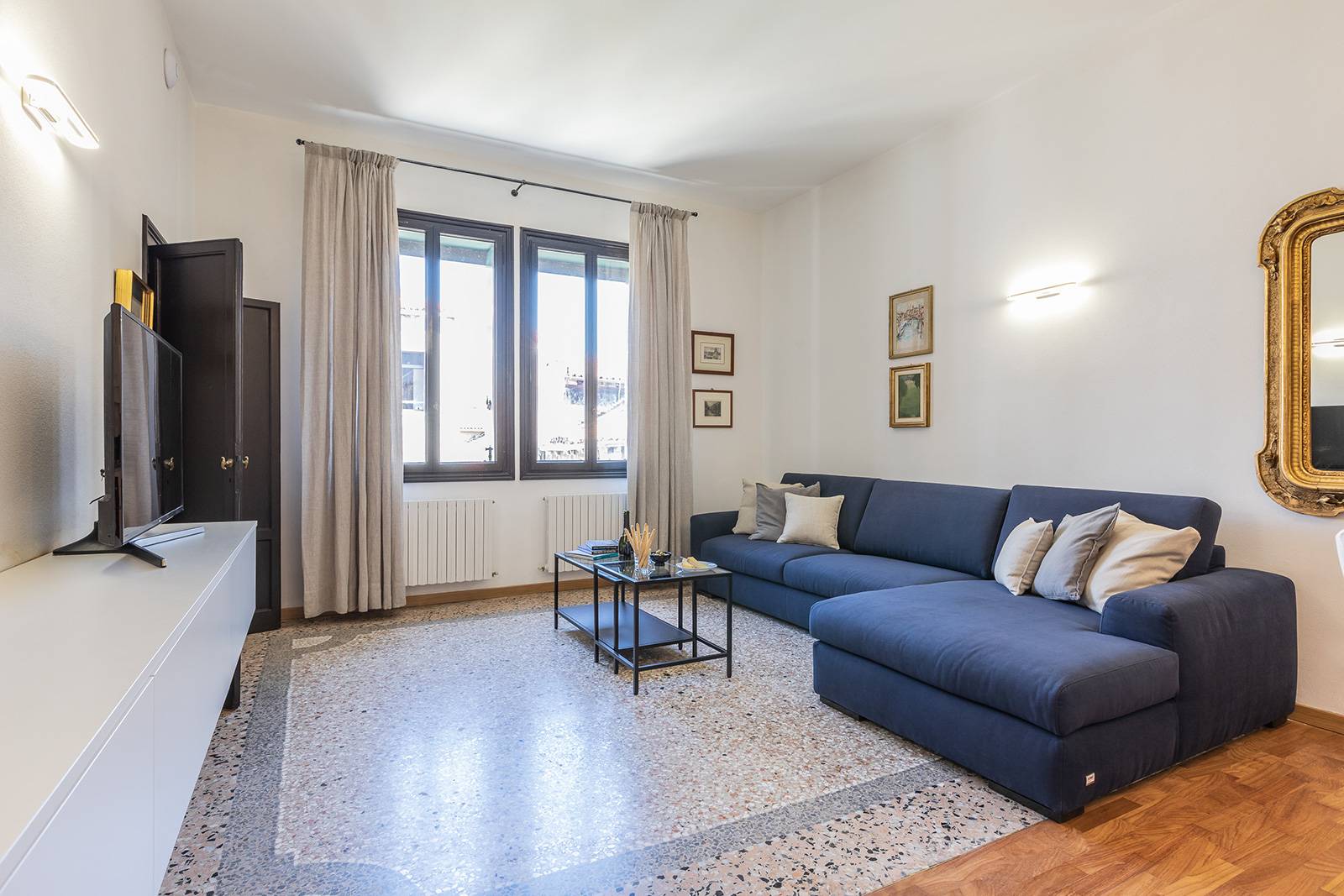 elegant Terrazzo Veneziano flooring, nice fabrics, plenty of natural light