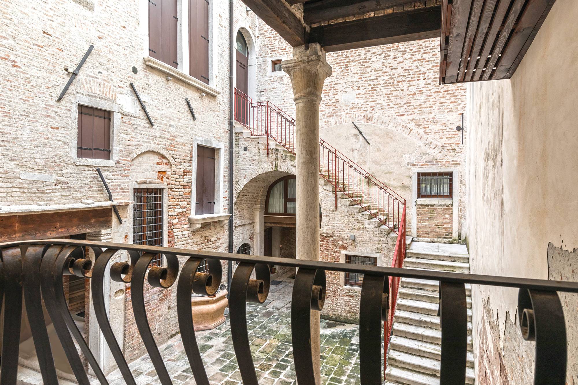 there is a small "Romeo & Juliet" kind of balcony facing the charming courtyard of this historical Palazzo
