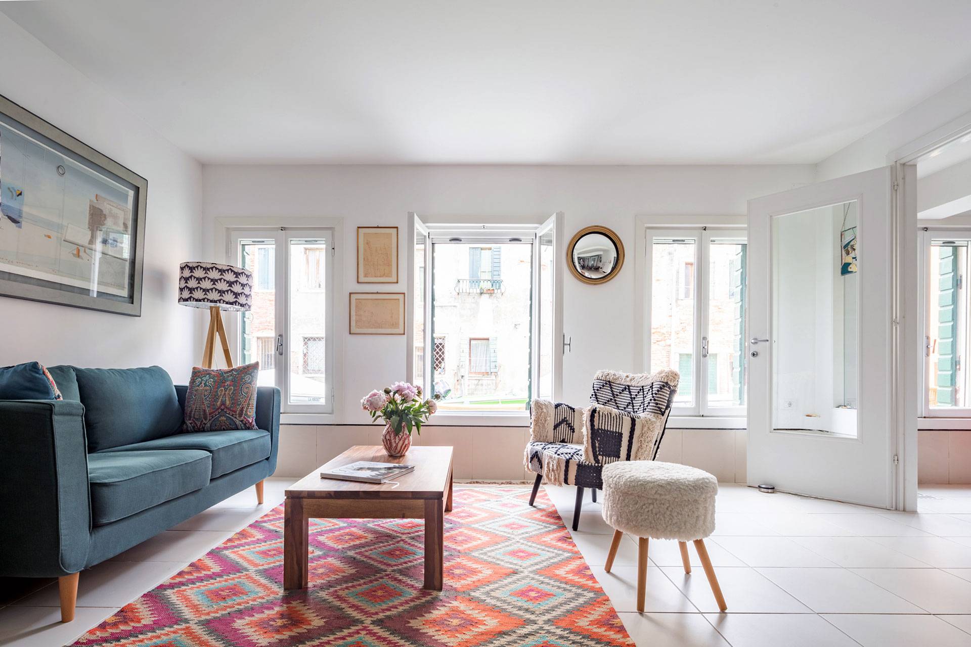 freshly furnished living room with plenty of natural light and canal view freshly furnished living room with plenty of natural light and canal view