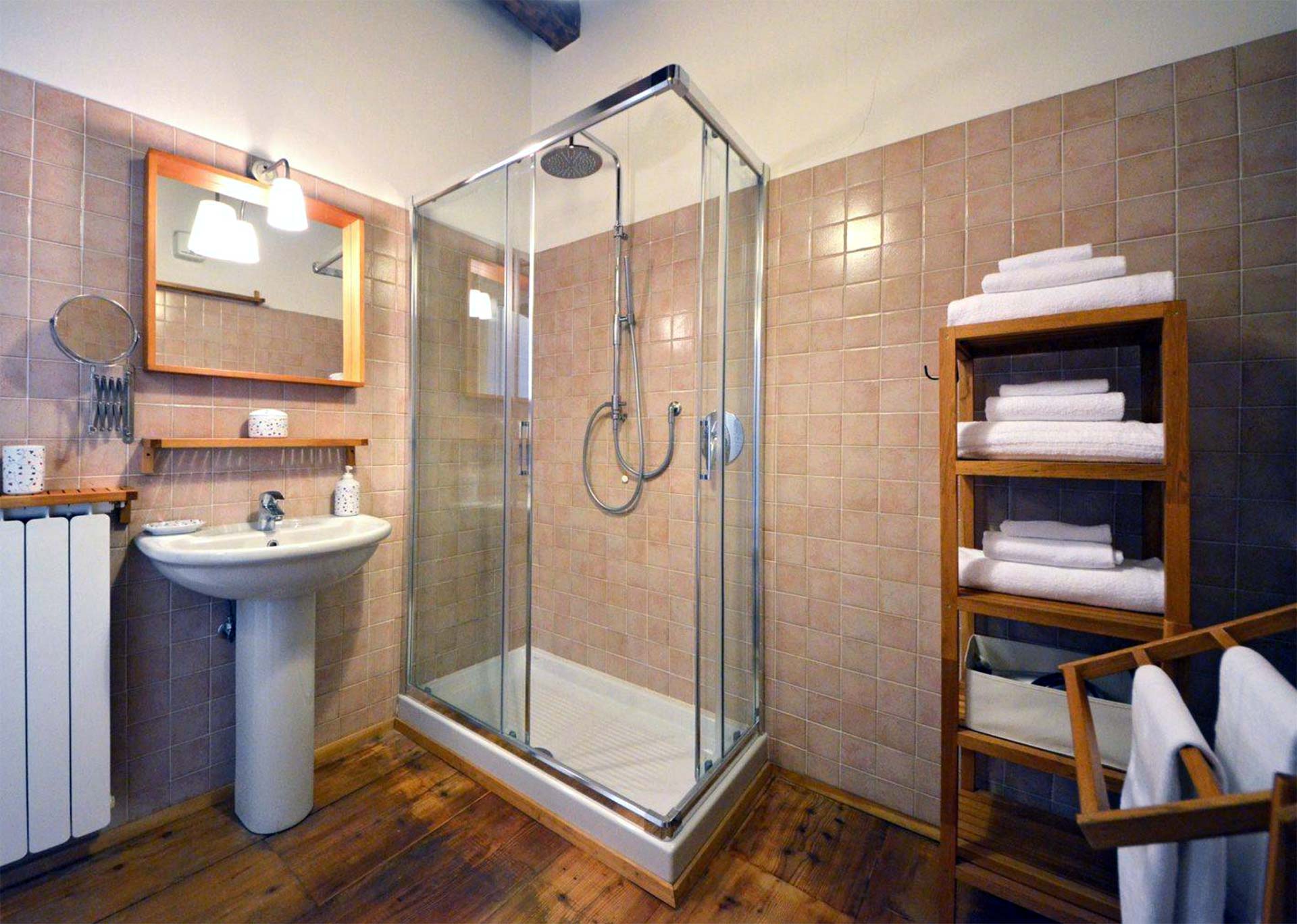 spacious bathroom with large shower cabin