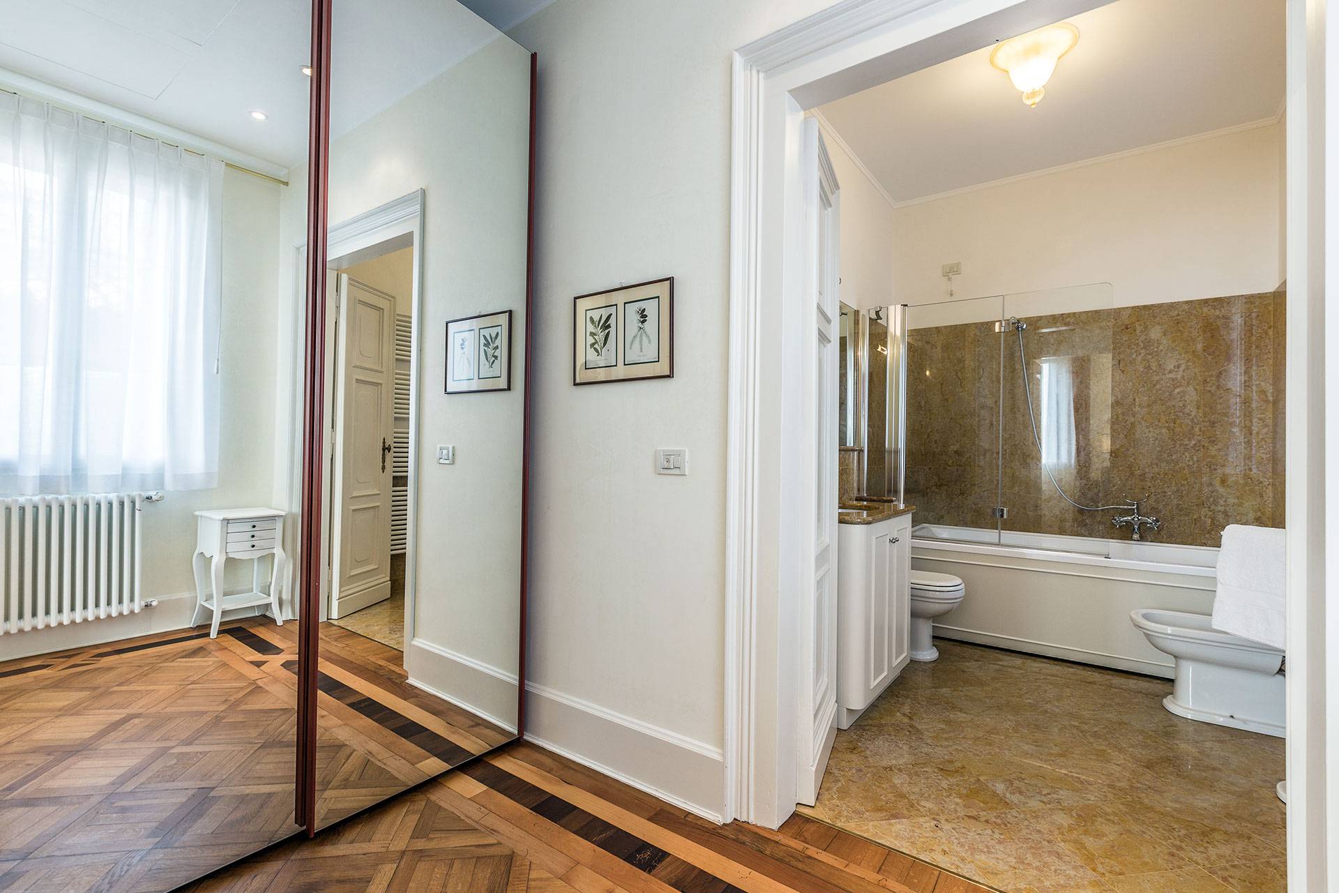 walk-in wardrobe between the bedroom and the bathroom
