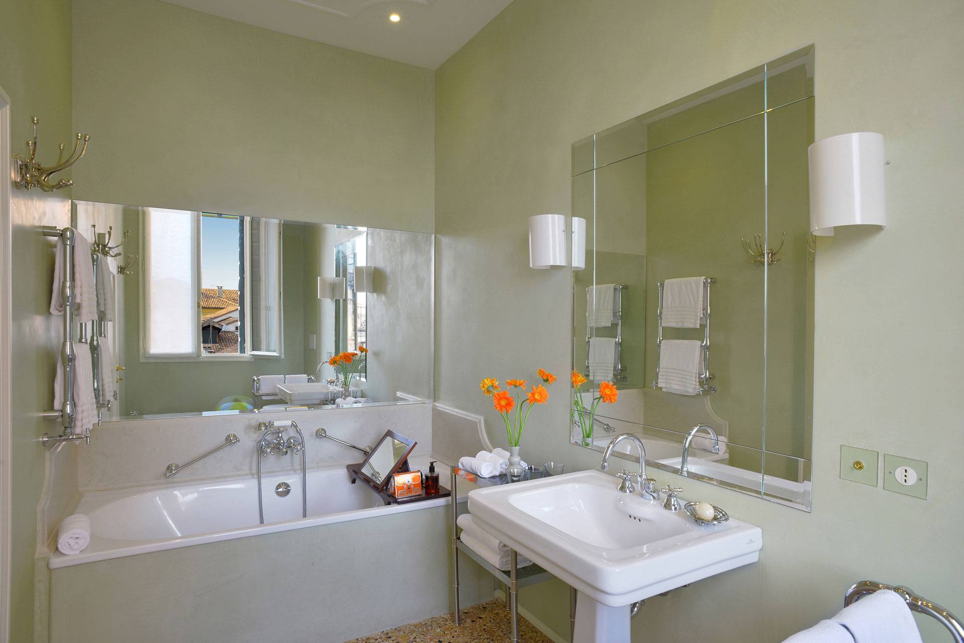 marble en-suite bathroom with bathtub