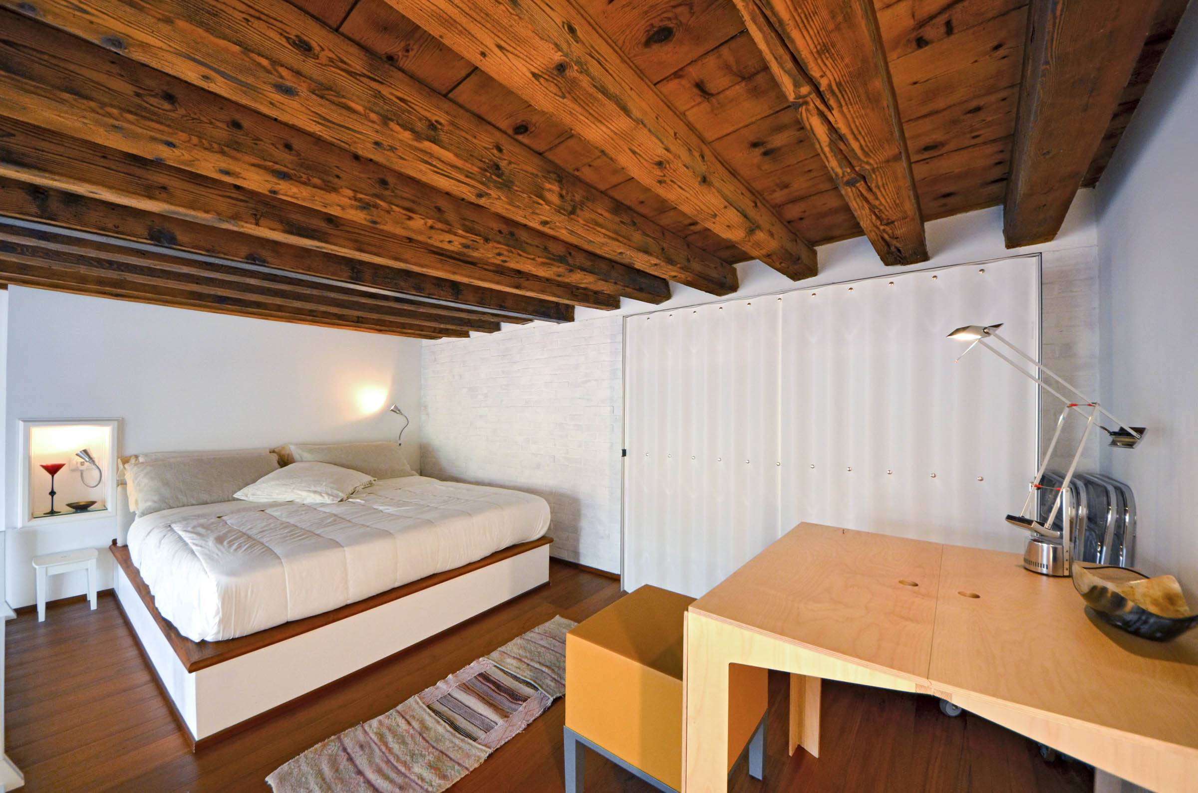 spacious bedroom in the gallery, the height of the wooden beams is 185 cm