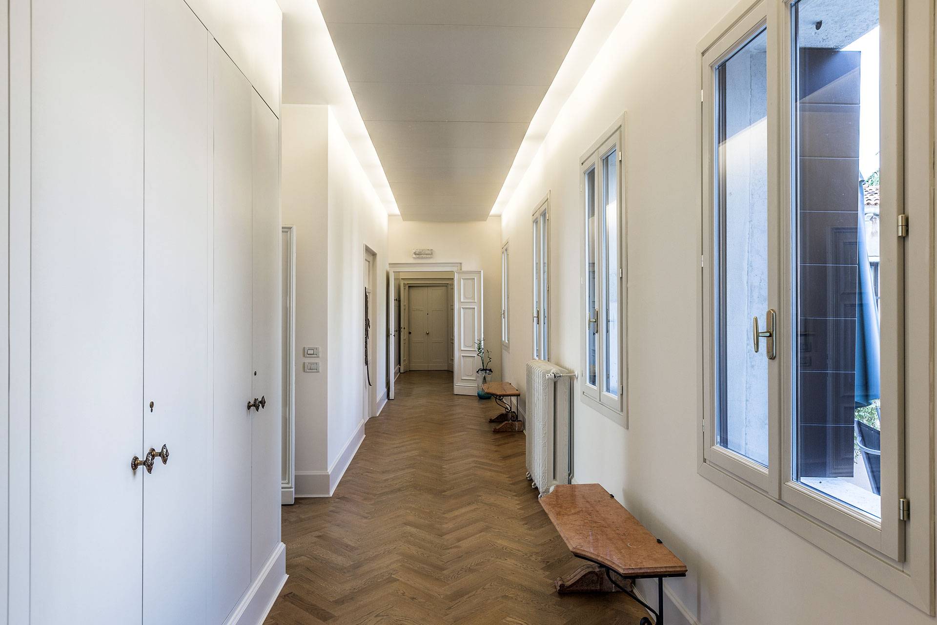 the communal hallway that connects the apartment with the shared terrace