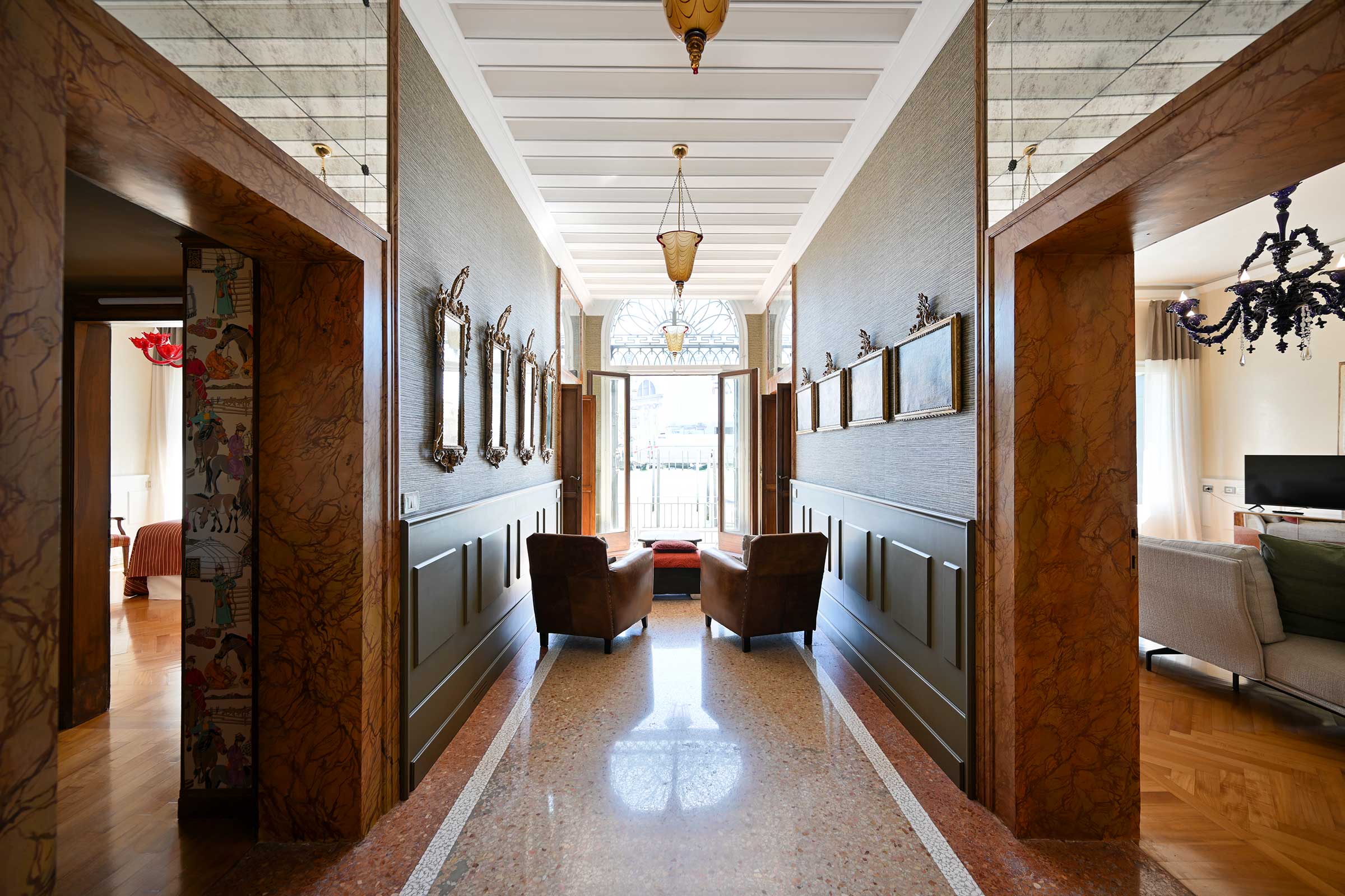 The central hall of the apartment opens on the Grand Canal