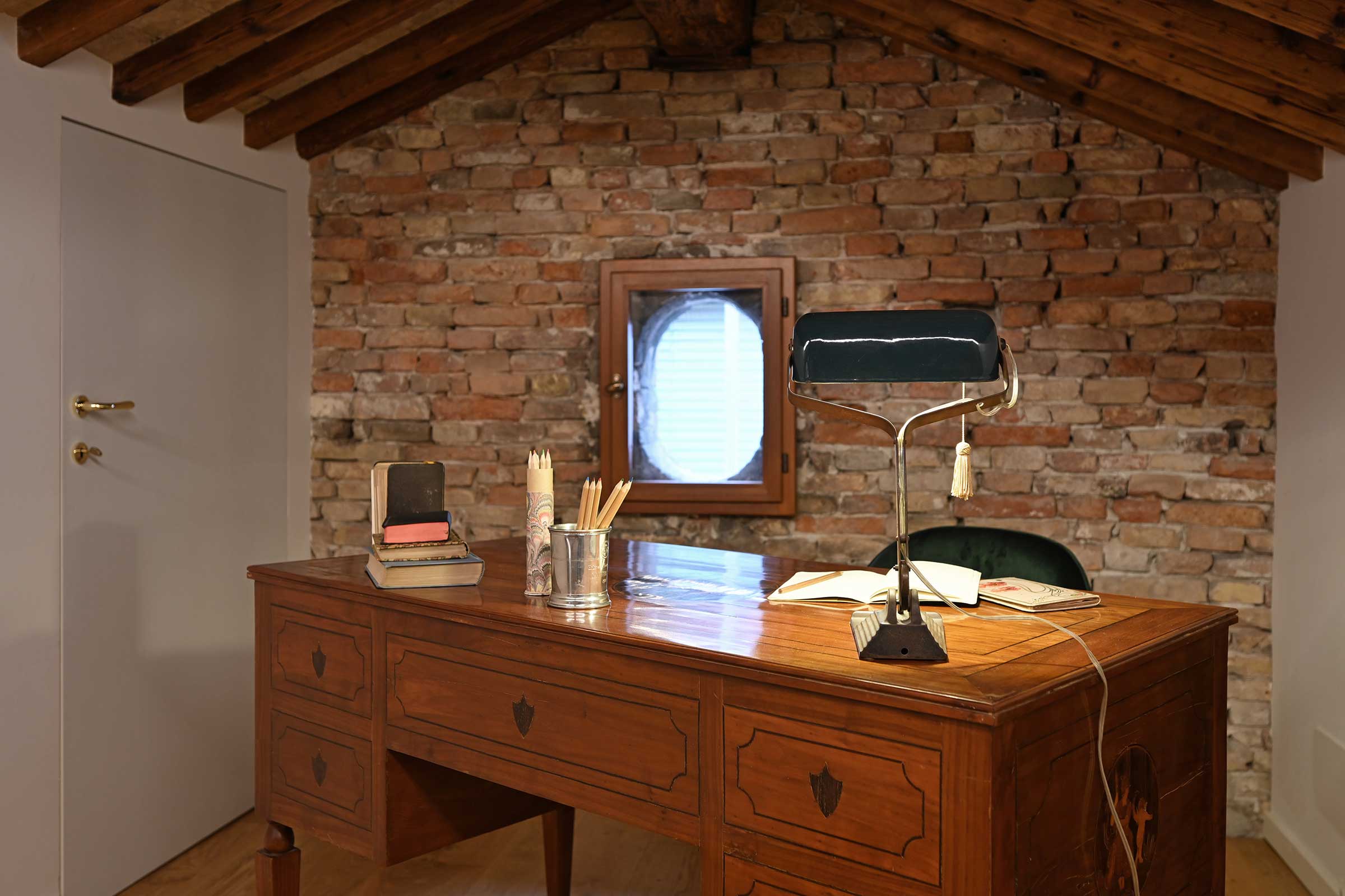 studio / office corner in the attic with antique desk