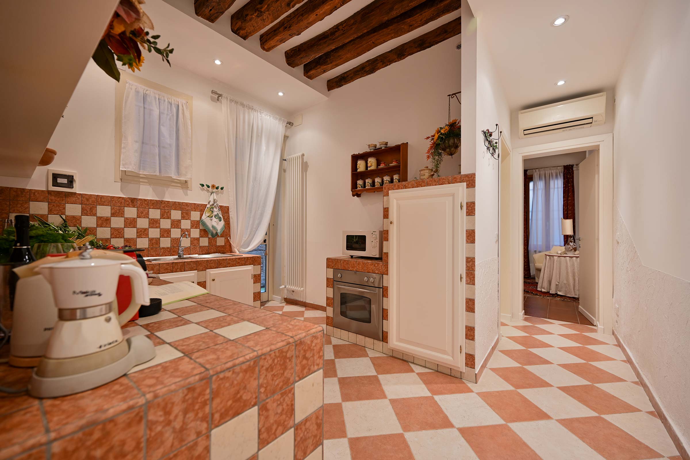 from the kitchen through a corridor you can access the bedroom