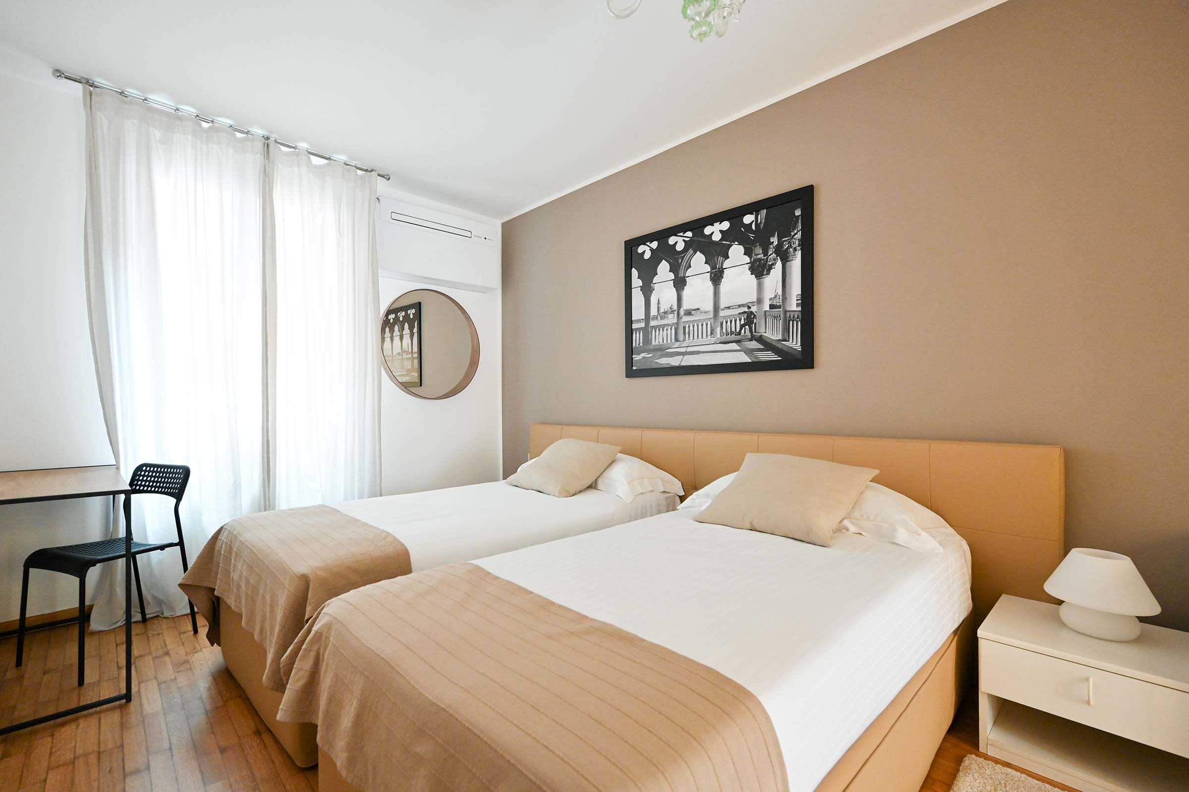 larger bedroom with 2 single beds that can be used as king size double on request