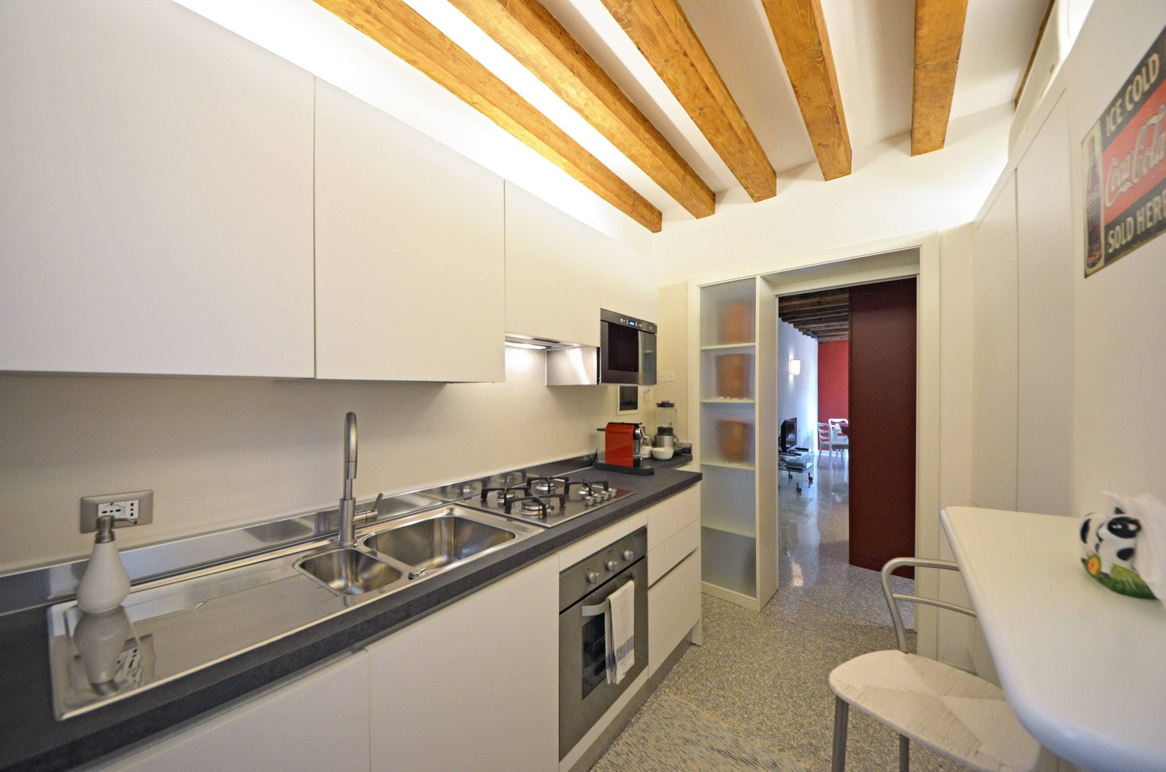 well-equipped kitchen of the Palladio apartment