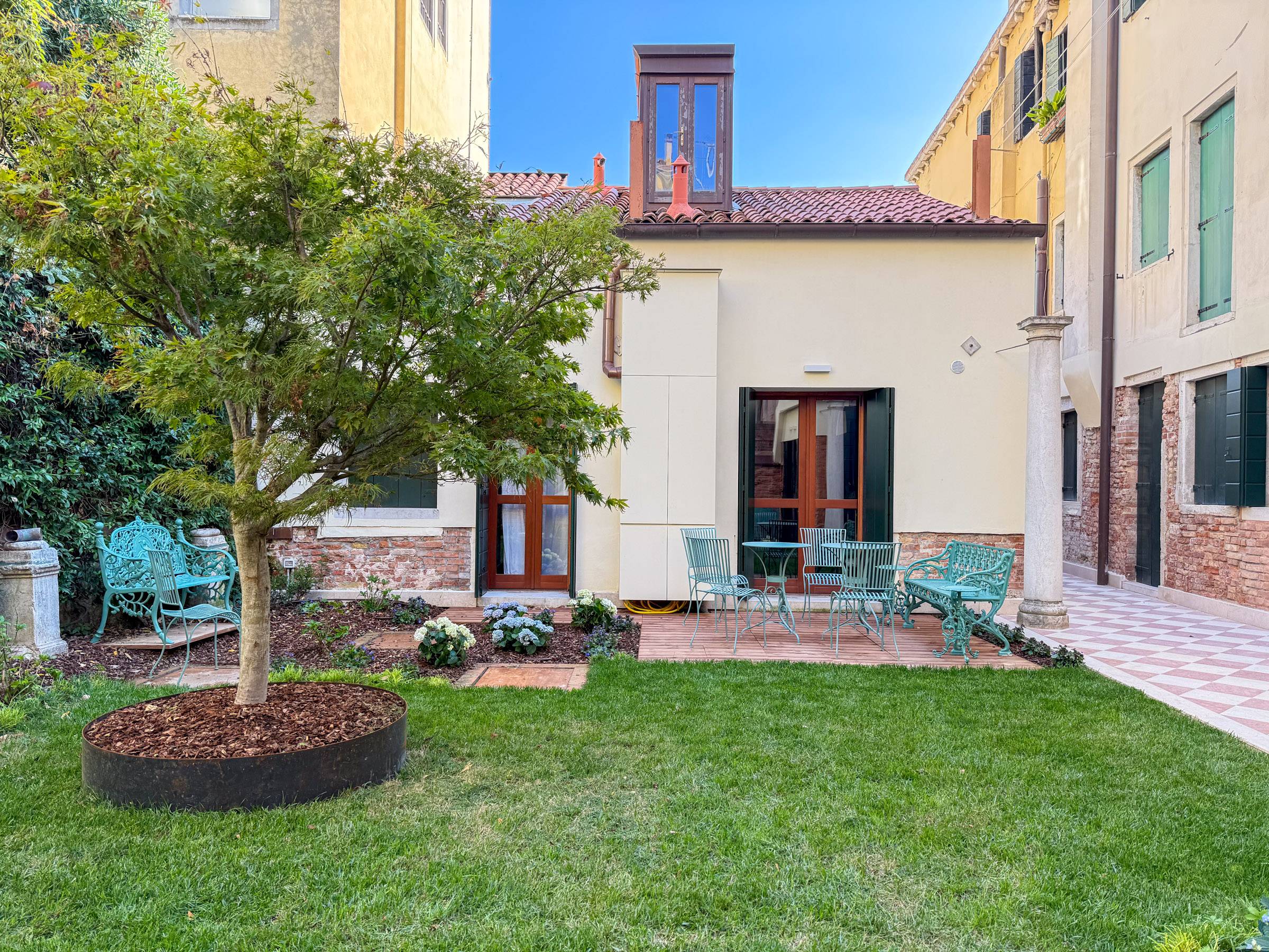 nice wooden deck and wrought iron furnishings nice wooden deck and wrought iron furnishings