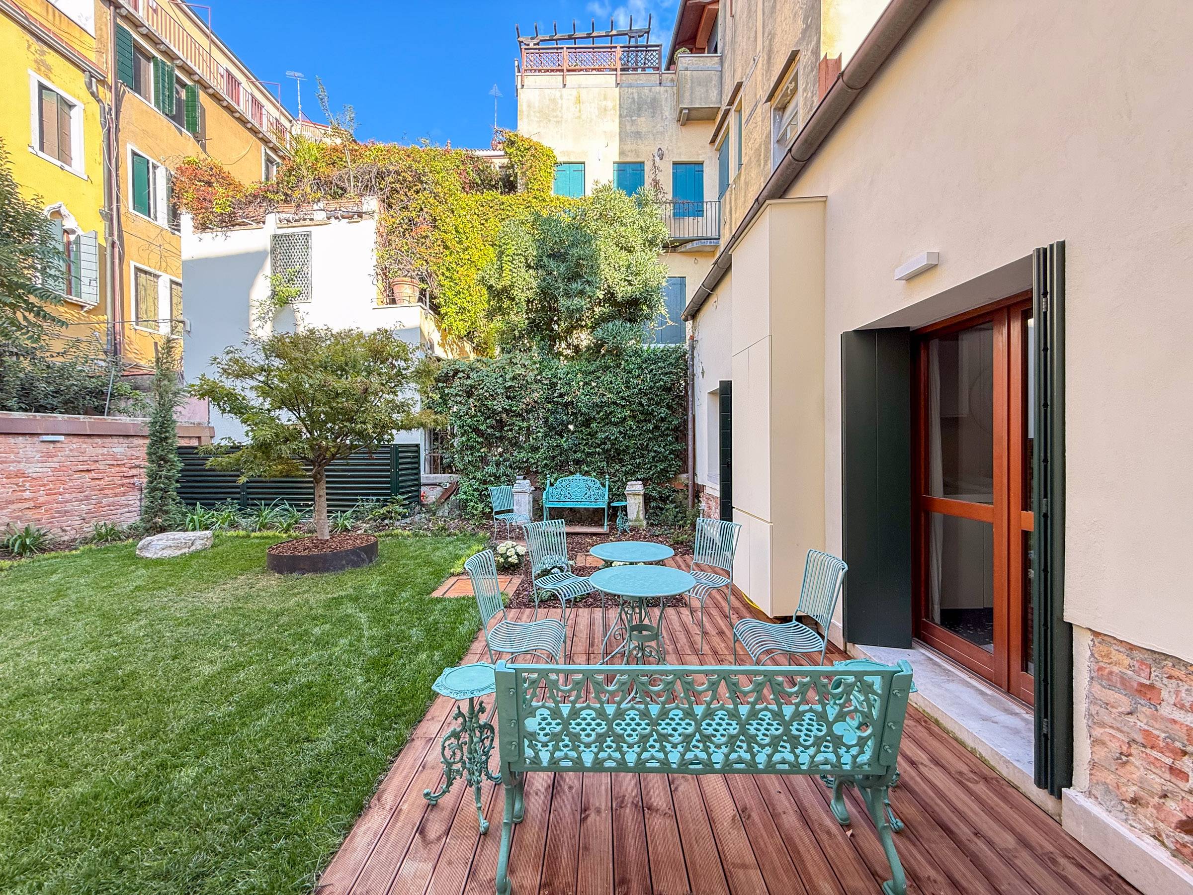 nice wooden deck and wrought iron furnishings nice wooden deck and wrought iron furnishings